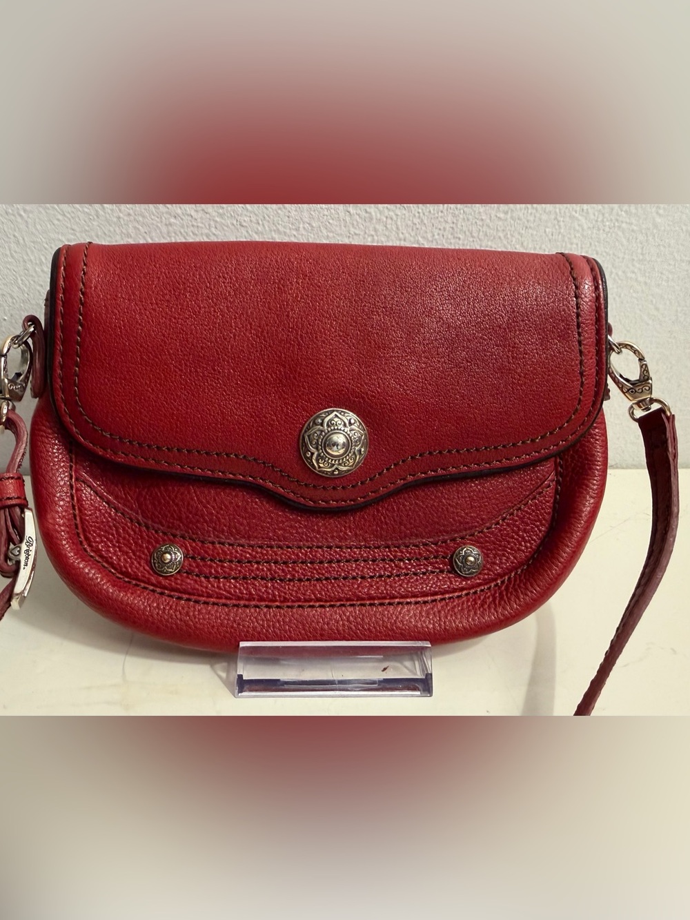 Brighton small red leather crossbody bag.